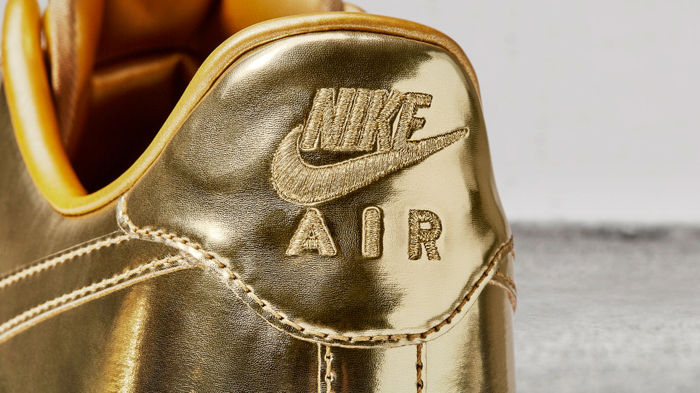 nike air force 1 low gold logo