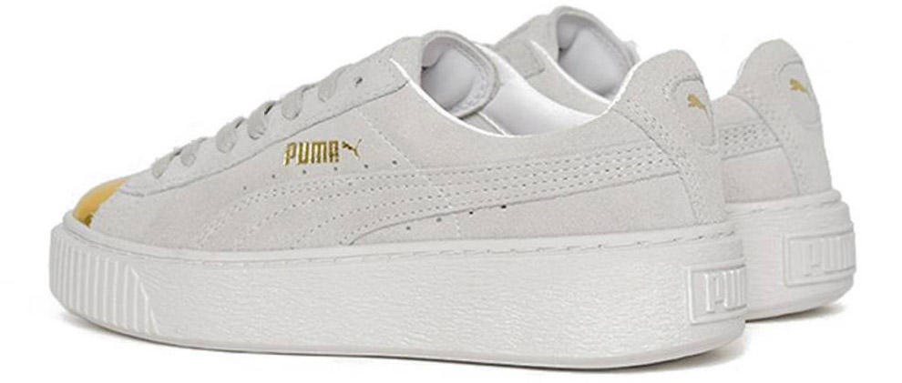 white pumas with gold toe