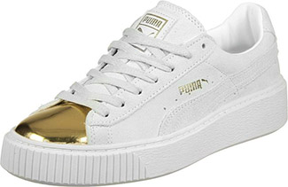 gold and white pumas with strap