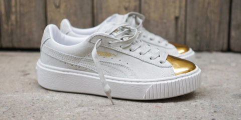 gold and white puma sneakers